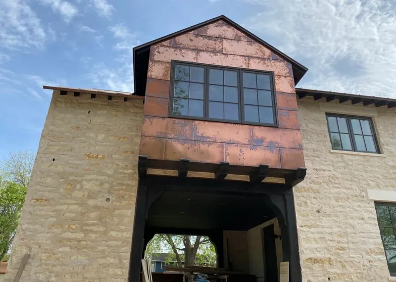 Copper metal panel facade on a stone building for Skylight Installation in Holtville